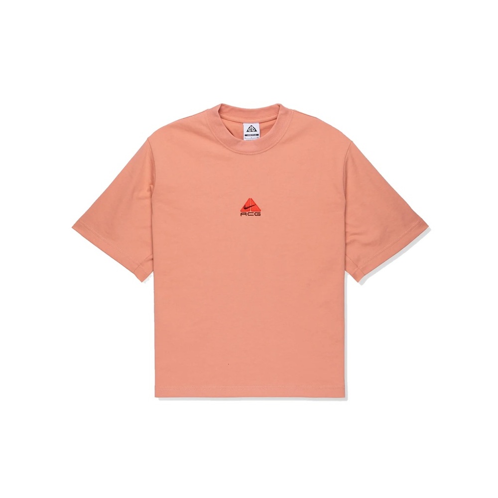 Nike ACG short sleeve tee in a soft peach/coral color.
